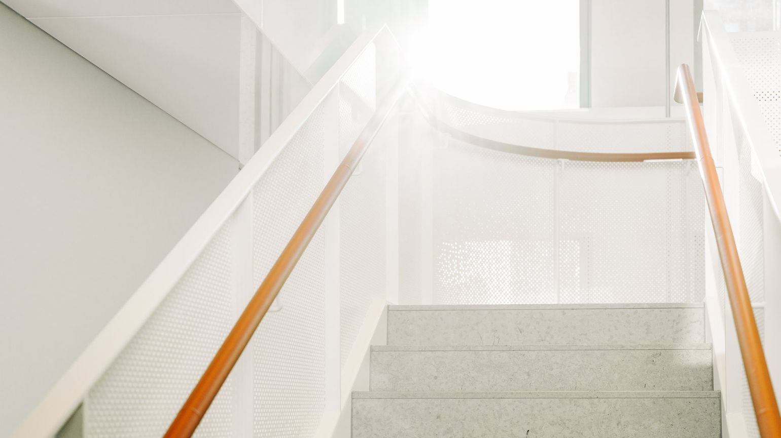 Stairwell with orange railings