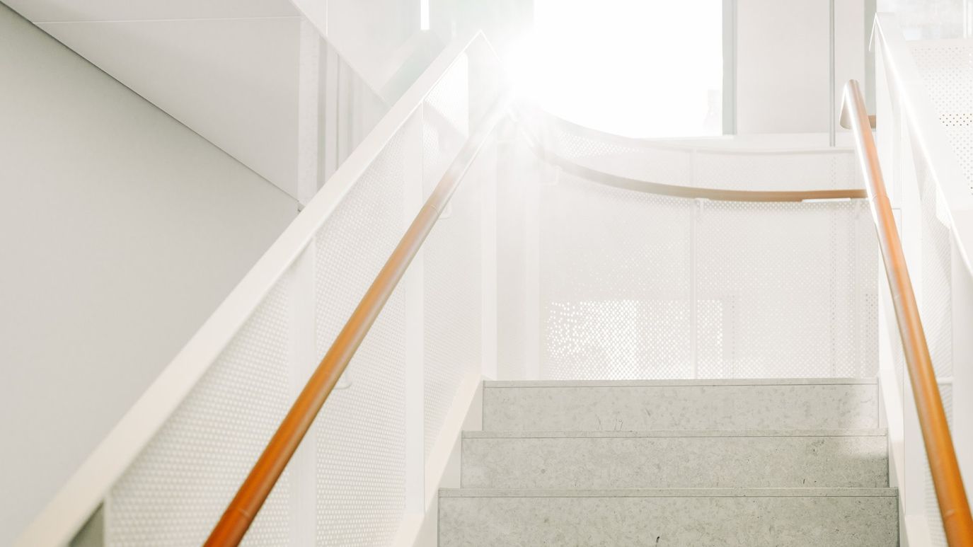 Stairwell with orange railings
