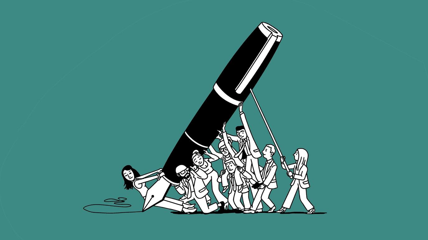 A dozen people hold up a giant pen.