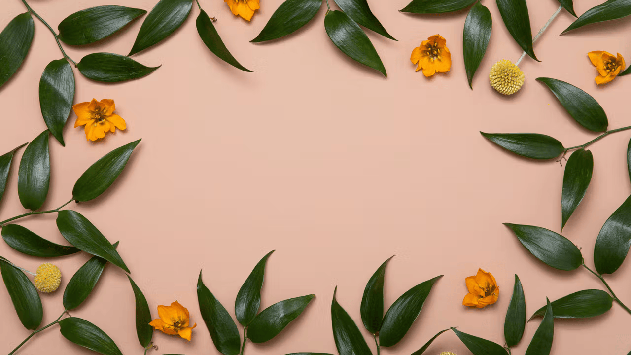 Green leaves and small orange flowers arranged in a border on a beige background.
