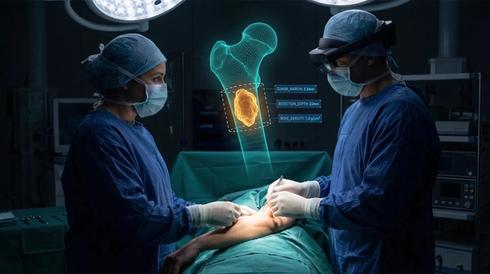 Two surgeons operating on a patient while a holographic bone scan with tumor data floats above, one surgeon wearing an augmented reality headset.