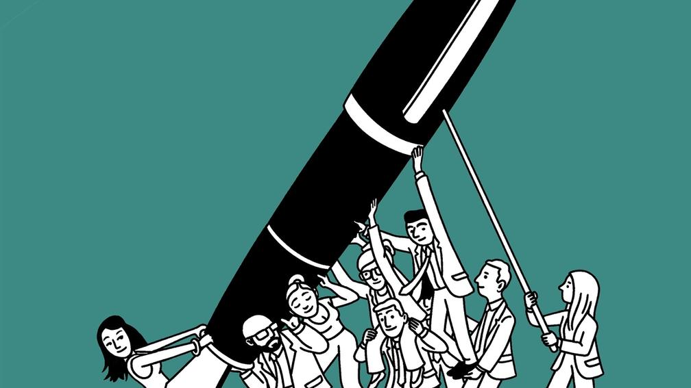 A dozen people hold up a giant pen.