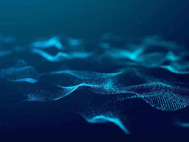 An abstract digital wave pattern composed of blue dots and lines, creating a flowing, dynamic effect on a dark background.