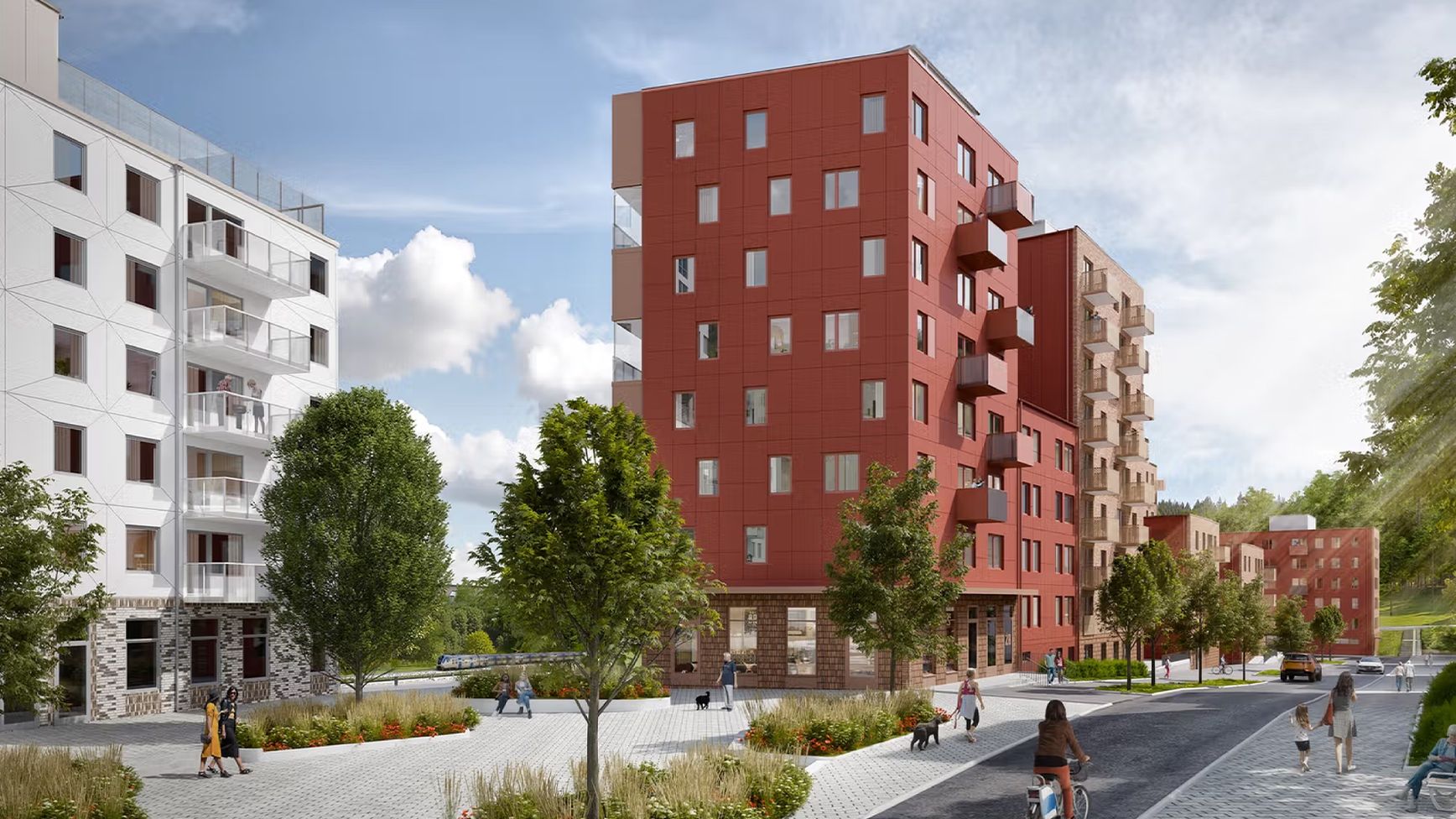 A modern residential neighborhood with red and white apartment buildings, trees, and people walking, cycling, and enjoying the outdoor space on a sunny day.