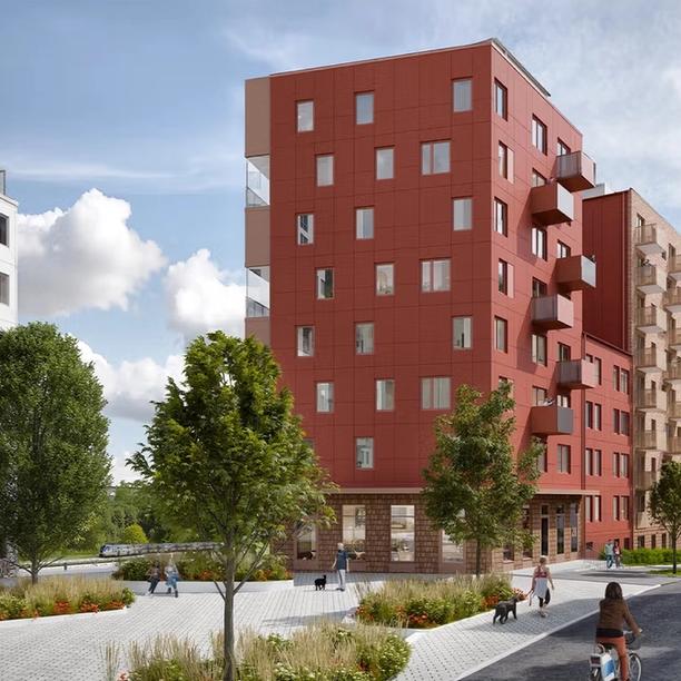 A modern residential neighborhood with red and white apartment buildings, trees, and people walking, cycling, and enjoying the outdoor space on a sunny day.