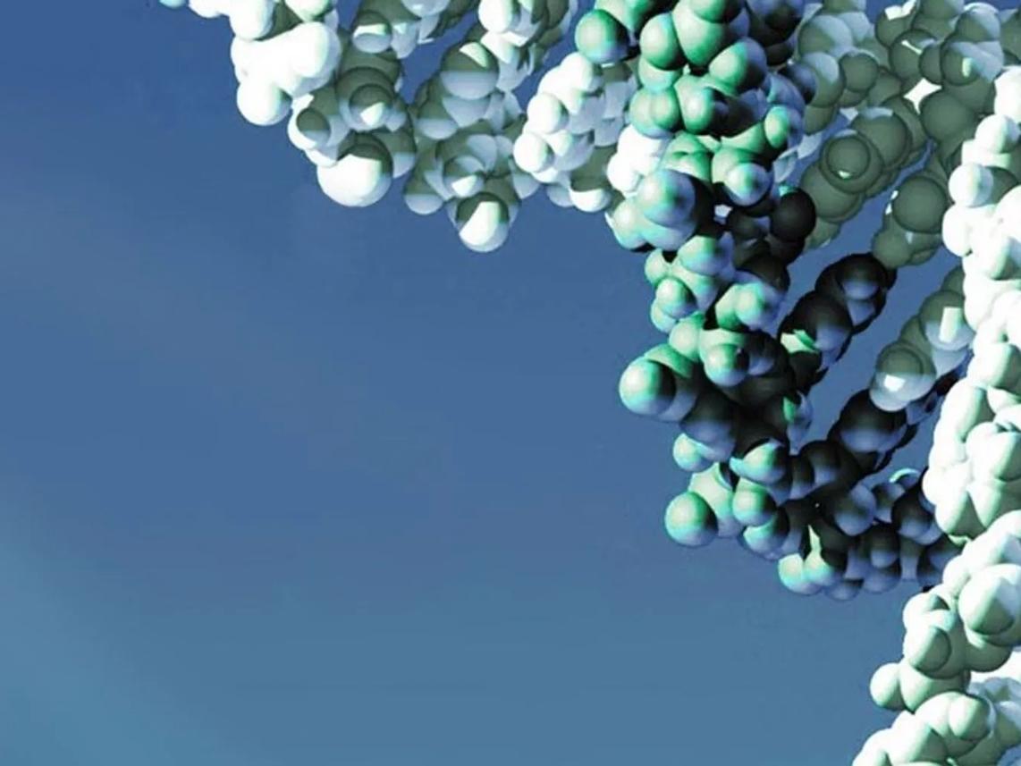 A 3D molecular structure composed of interconnected spheres in shades of green and white.