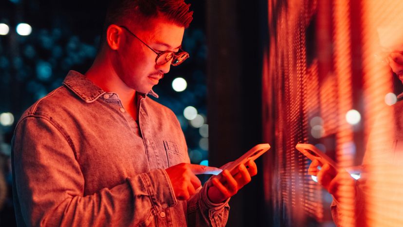 A man looks at his phone