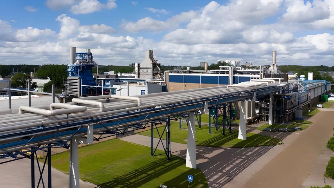 Pipes running into an industrial building.