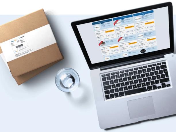 A laptop displaying a shipping service comparison chart.