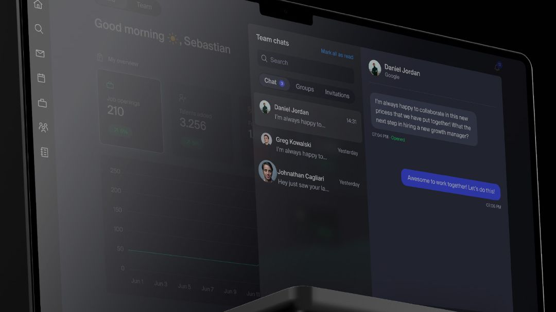 A laptop screen shows a team chat.
