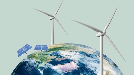 Two wind turbines and two solar panel arrays are illustrated on top of a globe, representing renewable energy sources.