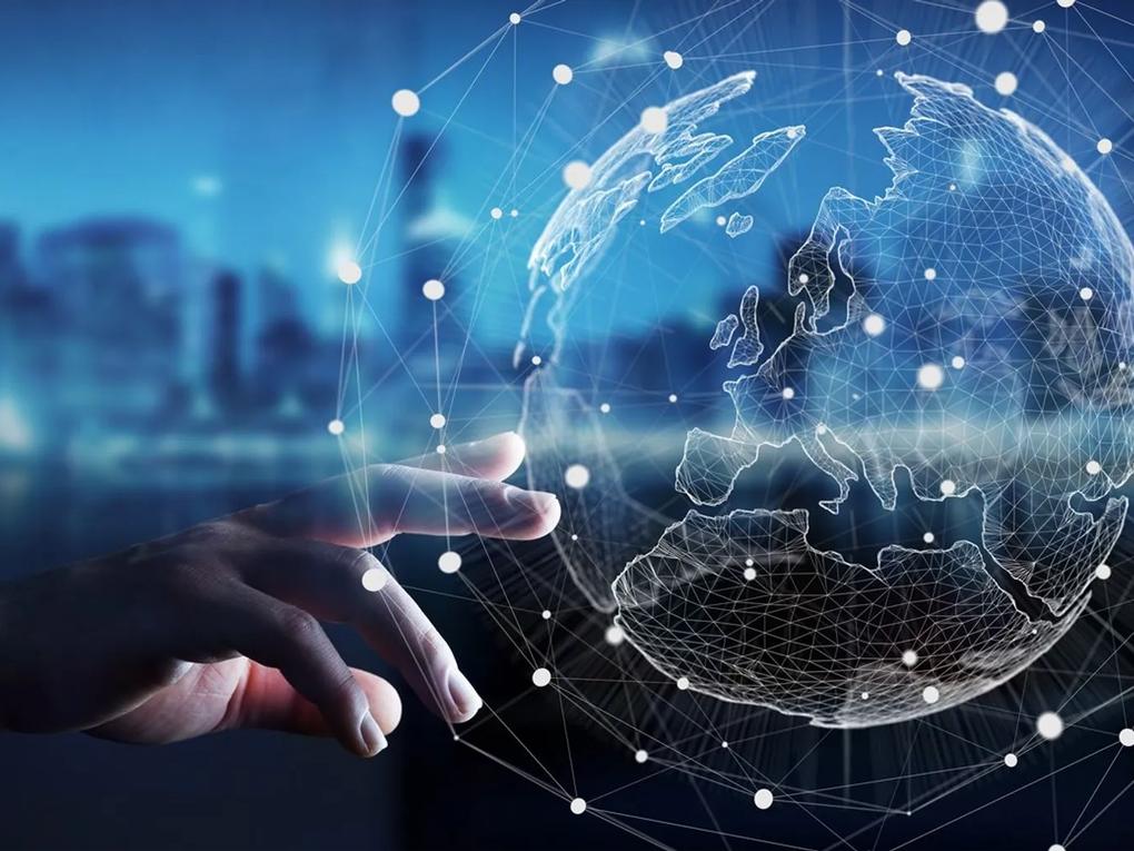 A hand reaching towards a digital globe with a network of interconnected lines and nodes.