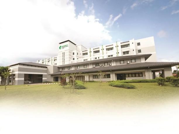 A large, modern hospital building labeled "Regency Specialist Hospital".