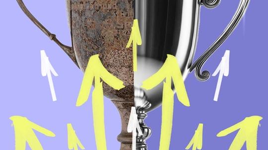Arrows point upward on a trophy, half of which is shiny while the other half is tarnished.