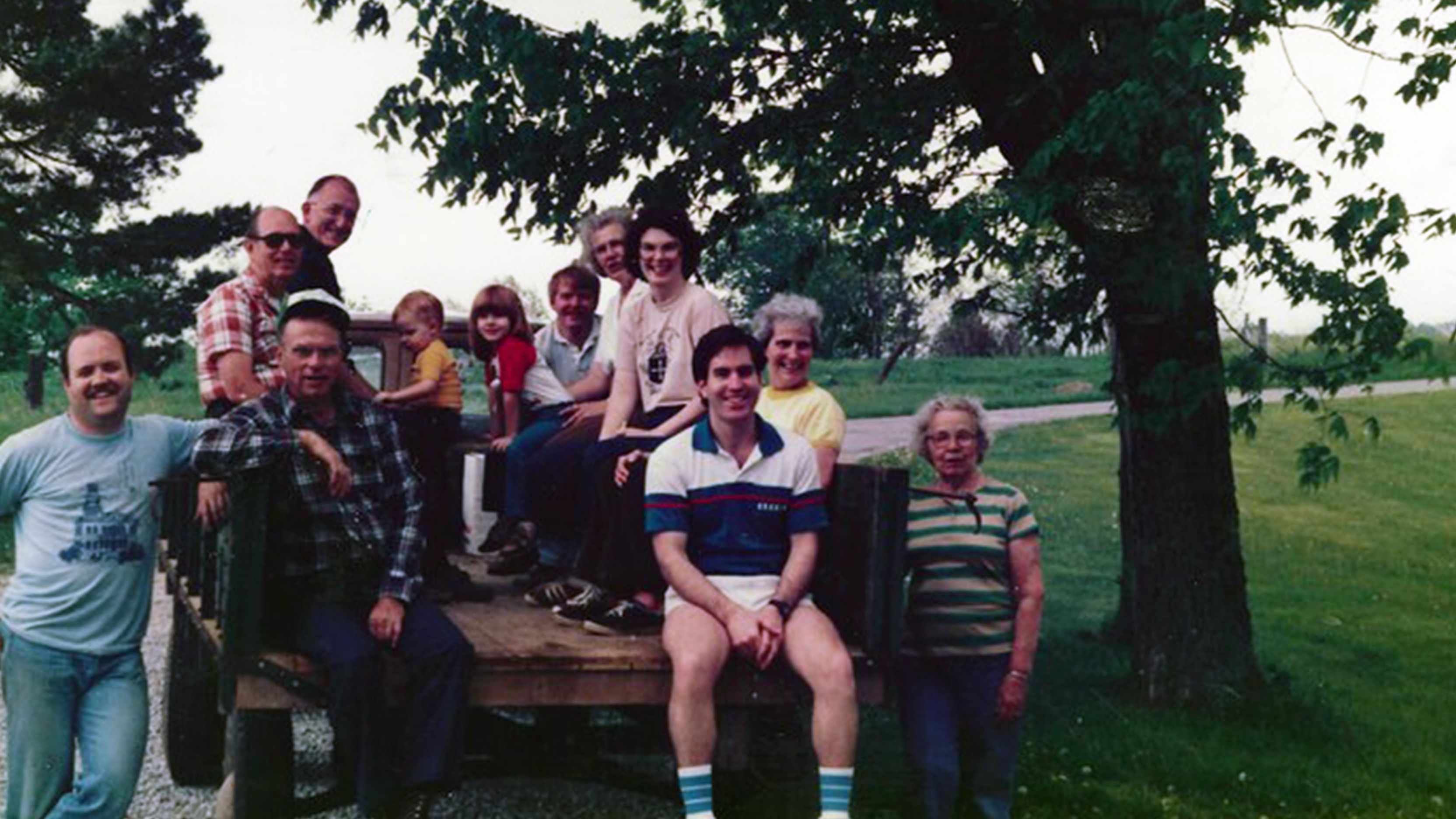 Marah Marshall's farming family sit on the back of an open-bed truck.