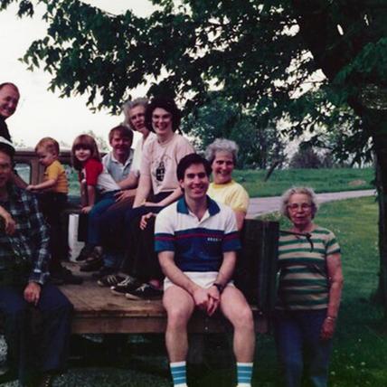 Marah Marshall's farming family sit on the back of an open-bed truck.