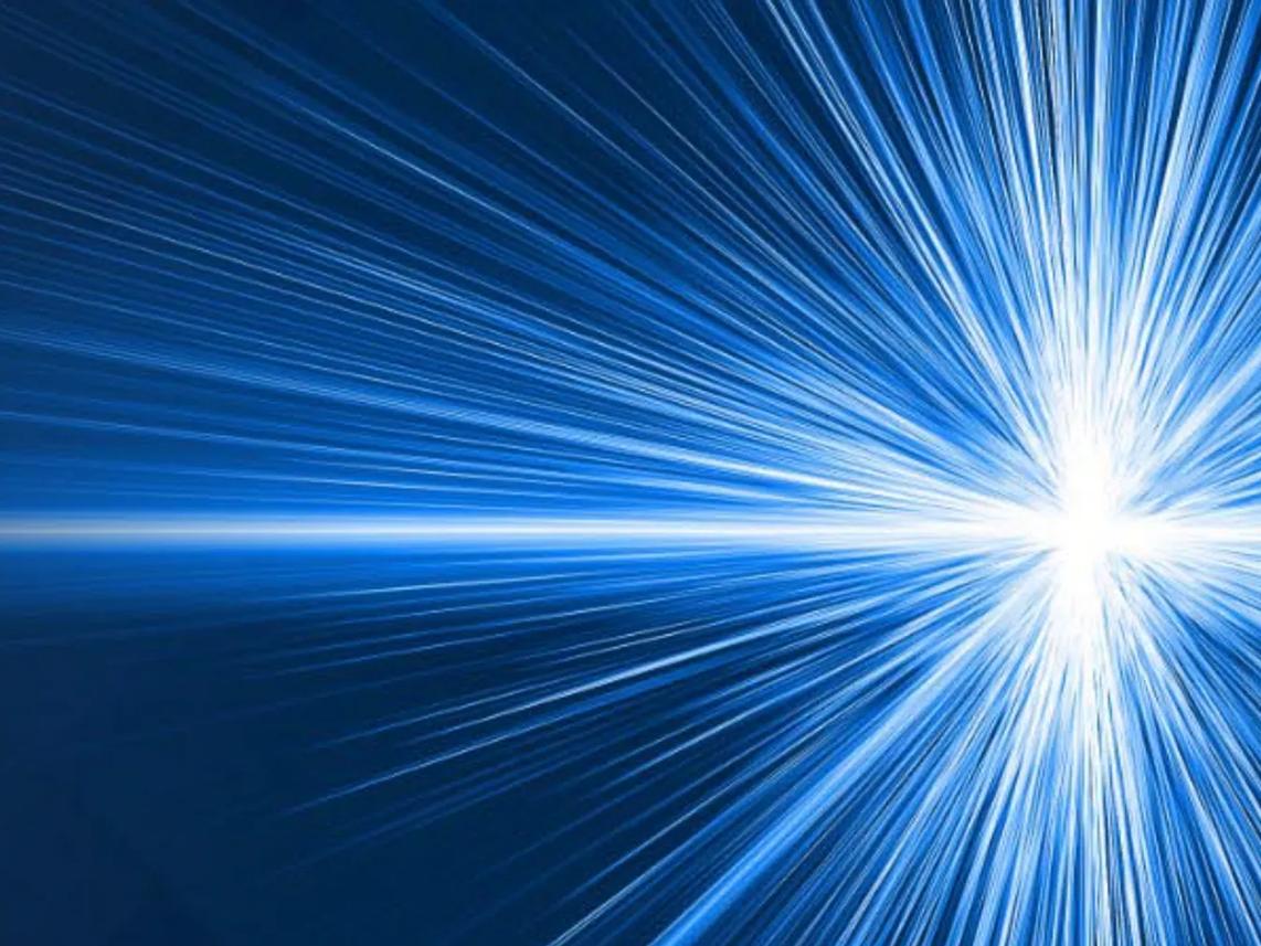 A burst of blue light rays radiating from a bright central point, creating a dynamic and energetic effect.