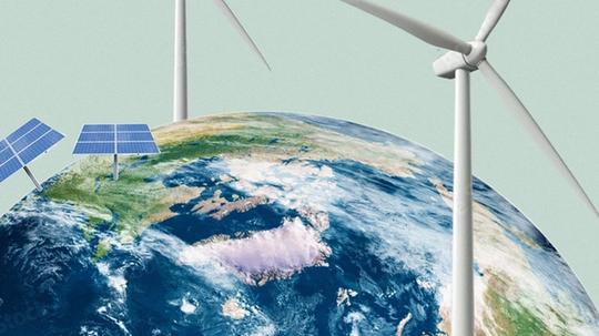 Two wind turbines and two solar panel arrays are illustrated on top of a globe, representing renewable energy sources.
