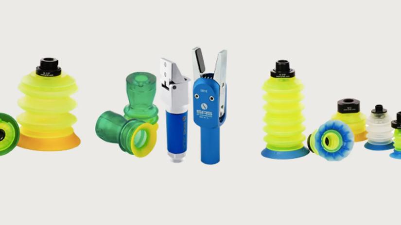Various industrial suction cups and vacuum components in different colors and sizes displayed on a white background.