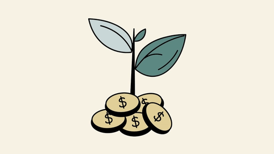 Green plant growing out of a collection of coins