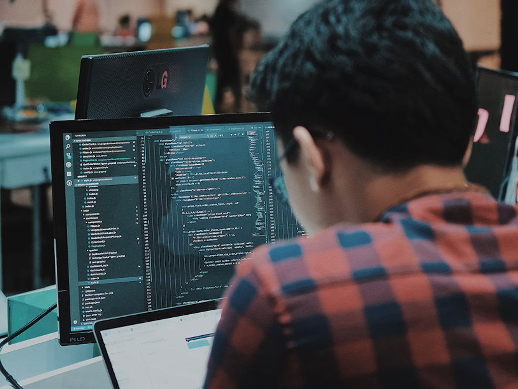 A developer working on his computer