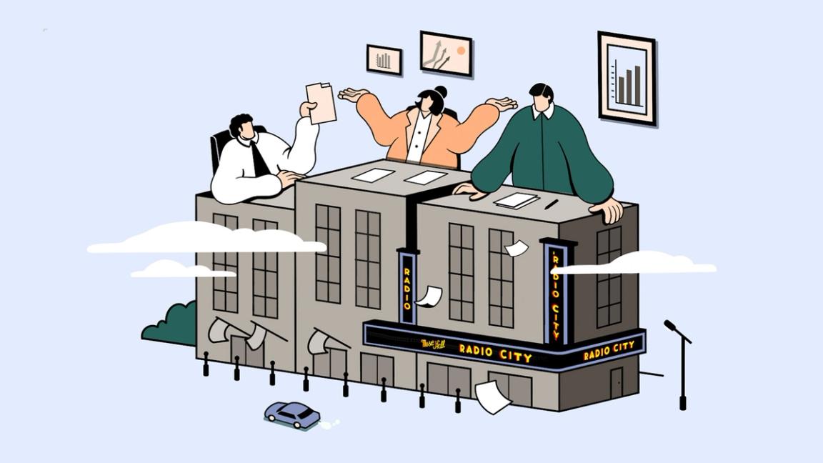 Giant people use buildings as a desk.