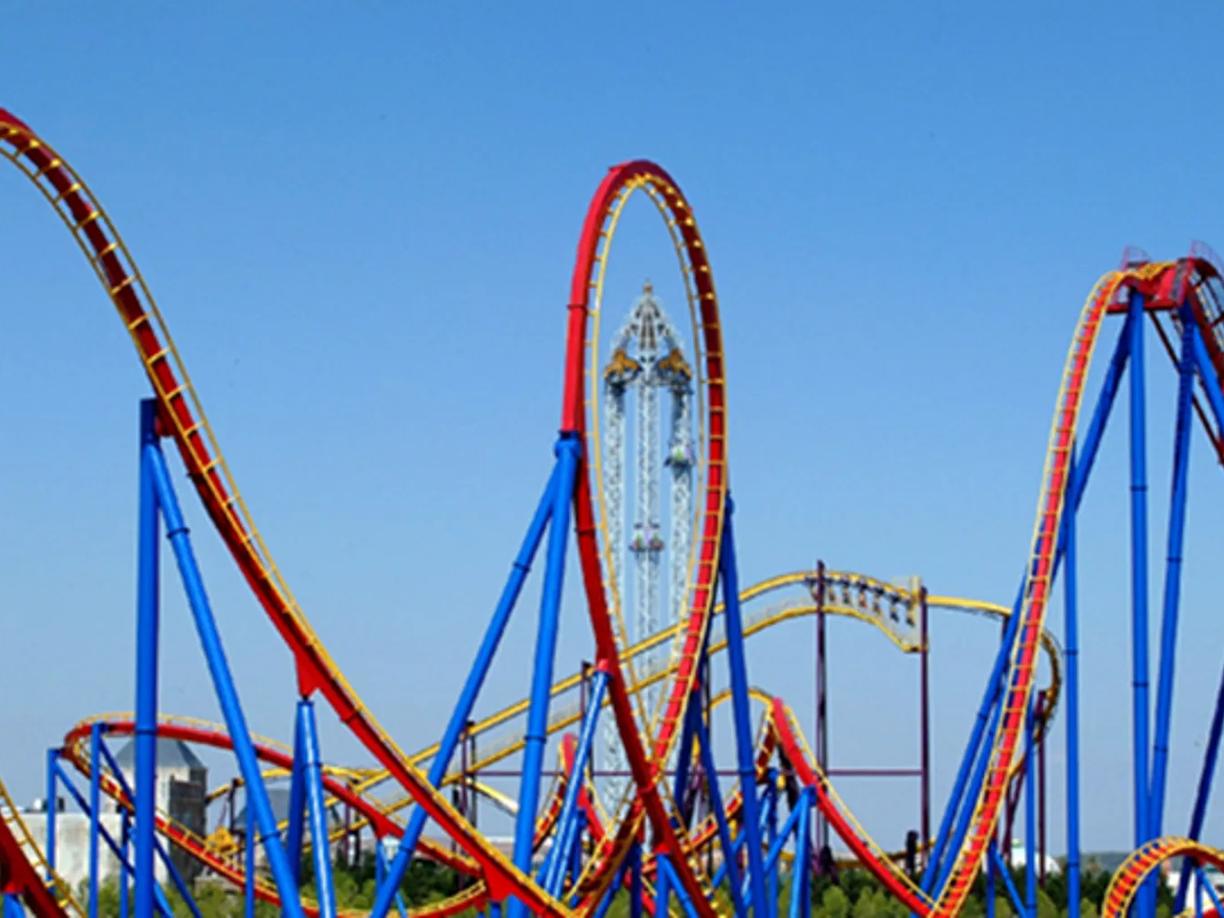 A colorful roller coaster with red and blue tracks and loops.