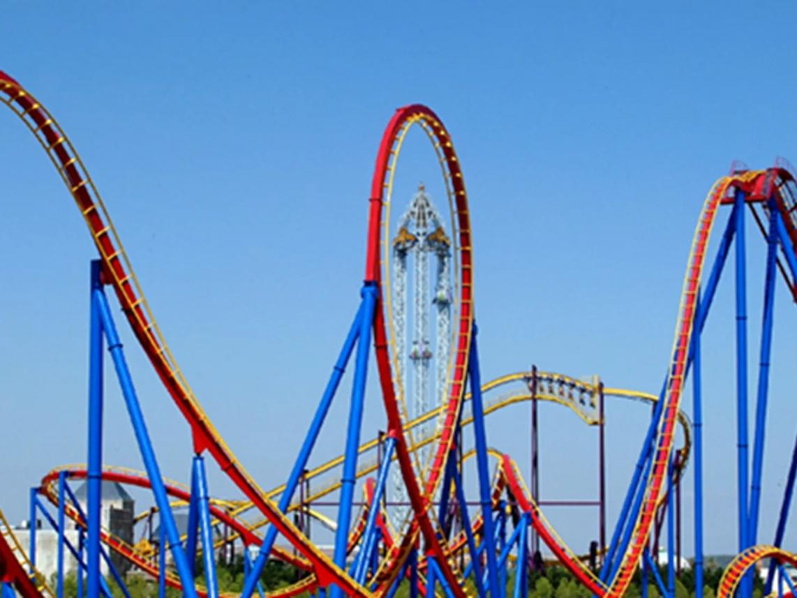 A colorful roller coaster with red and blue tracks and loops.