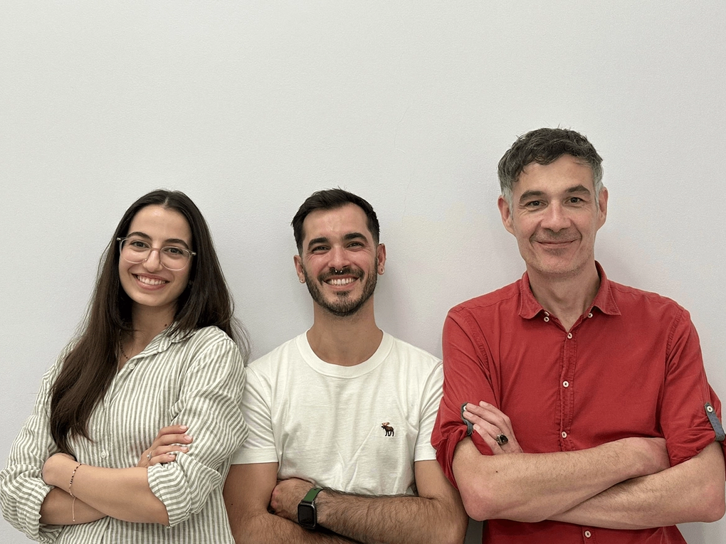 Image of three people smiling