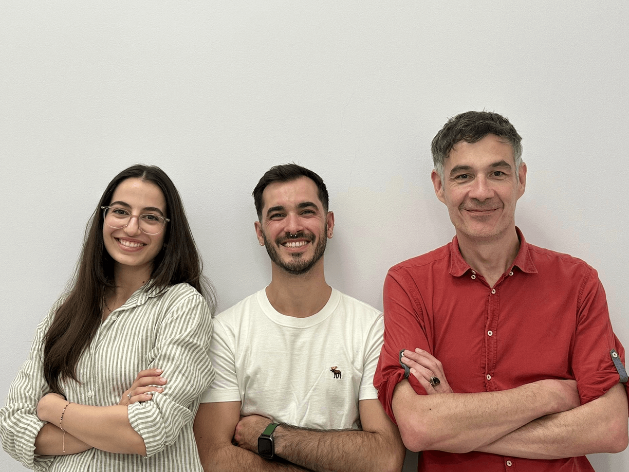 Image of three people smiling