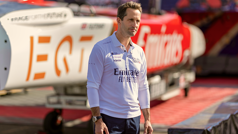 James Vowles, Team Principal of the Williams F1 Team, wearing a white team-branded polo shirt in front of the EQT logo.