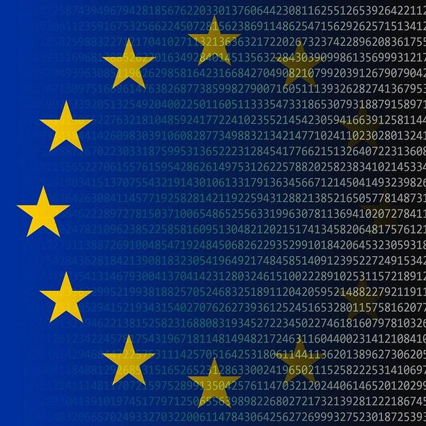 European Union flag with yellow stars mixed with computer text.