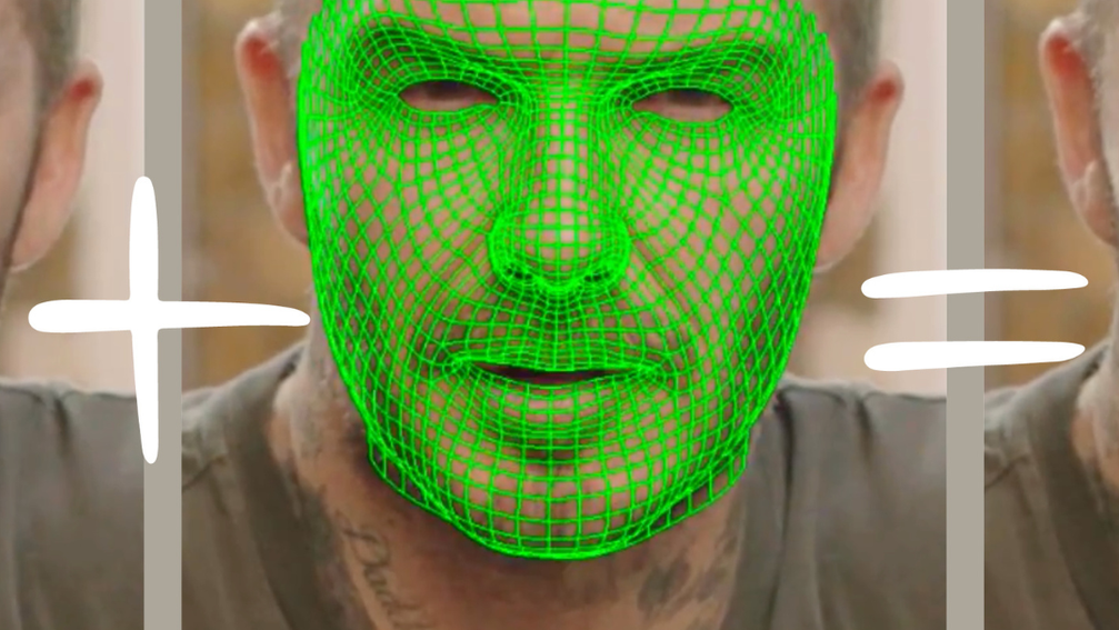 A green computer grid covers a man's face.