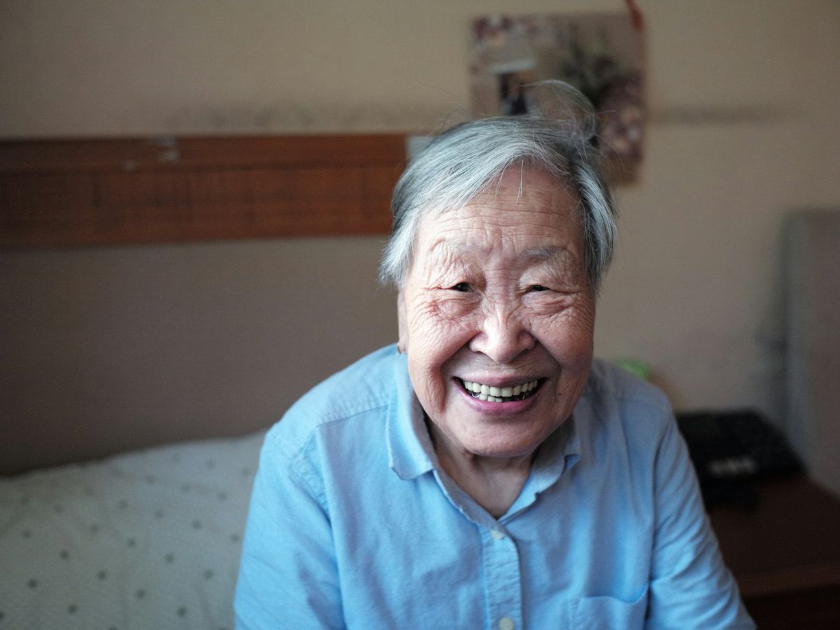 An older person with a happy look on their face.