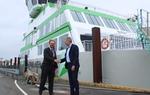 Molslinjen's CEO, Carsten Jensen, shaking hands with the Danish Minister for Transportation, Benny Engelbrecht, in front of the new electric ferry.