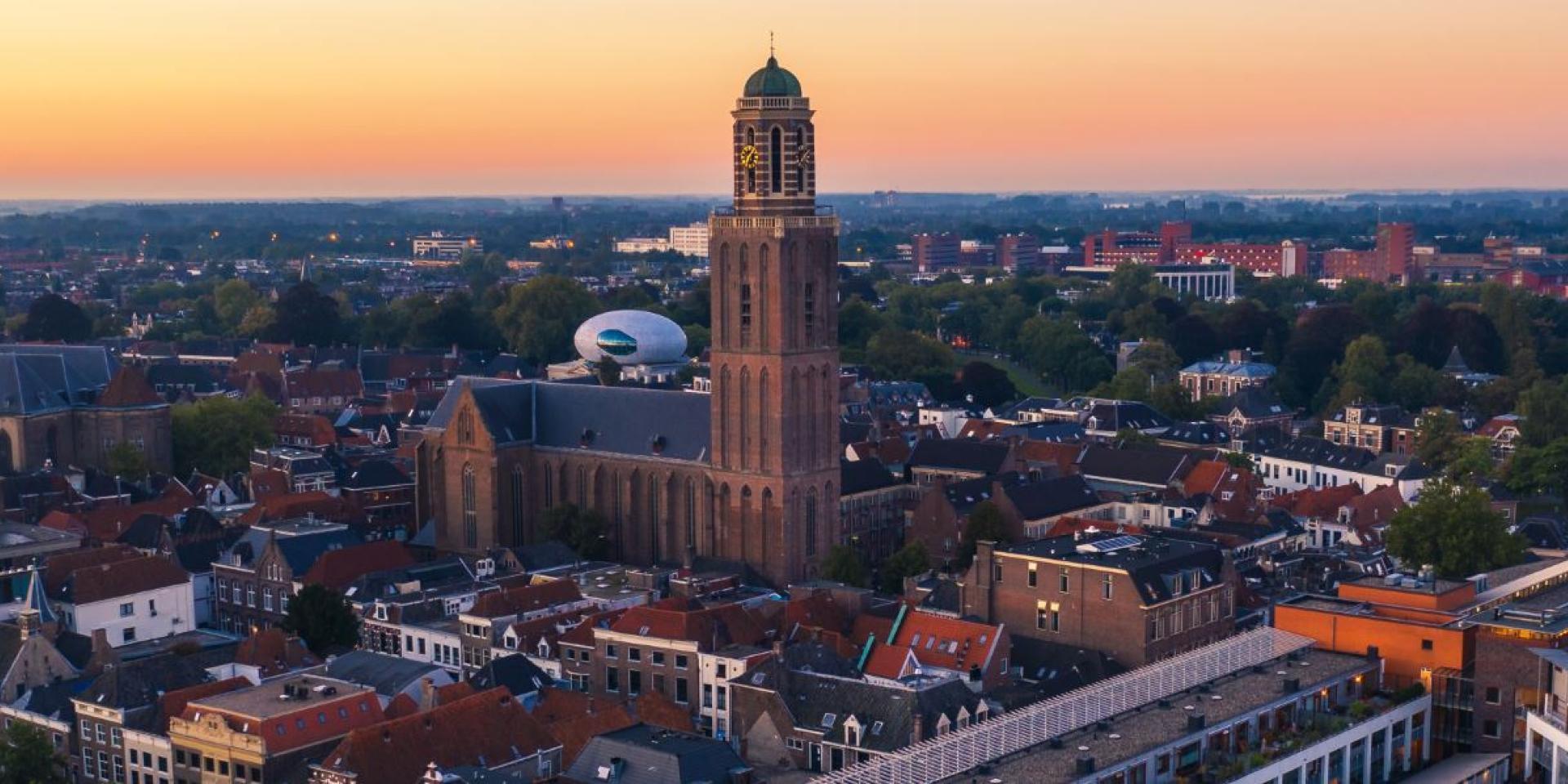 an aerial view of a city with a large church in the middle of it .