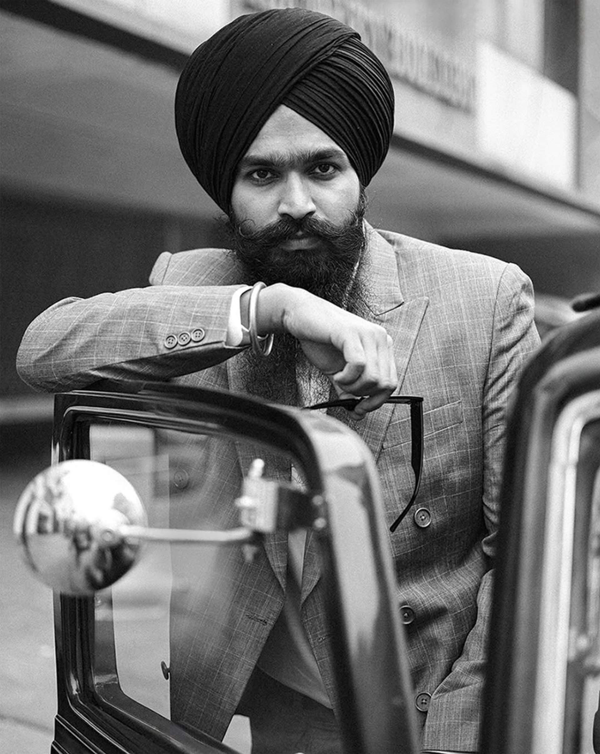 Maninder Singh in a turban and suit for House of Singh’s Zamana project, capturing the essence of vintage Sikhs from the 1960s and 1970s.