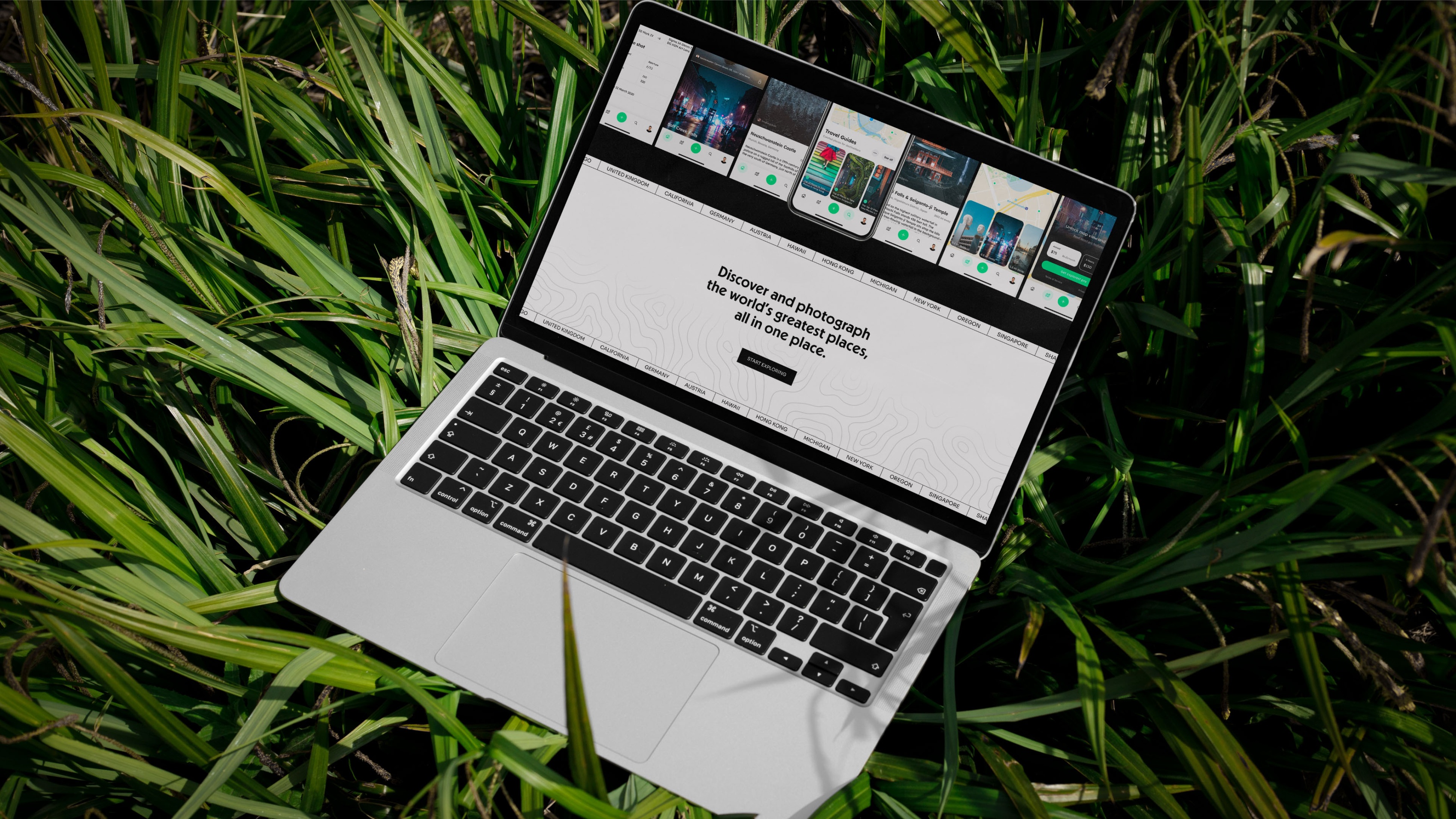 Photo of a Laptop on grass displaying the Explorest website