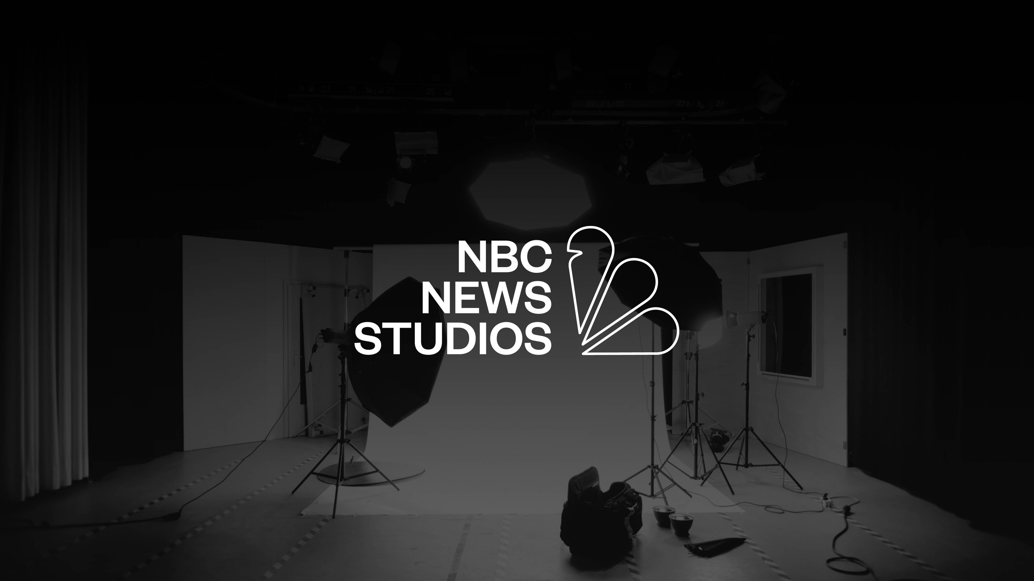 NBC News Studios logo over a picture of a studio setting in black and white