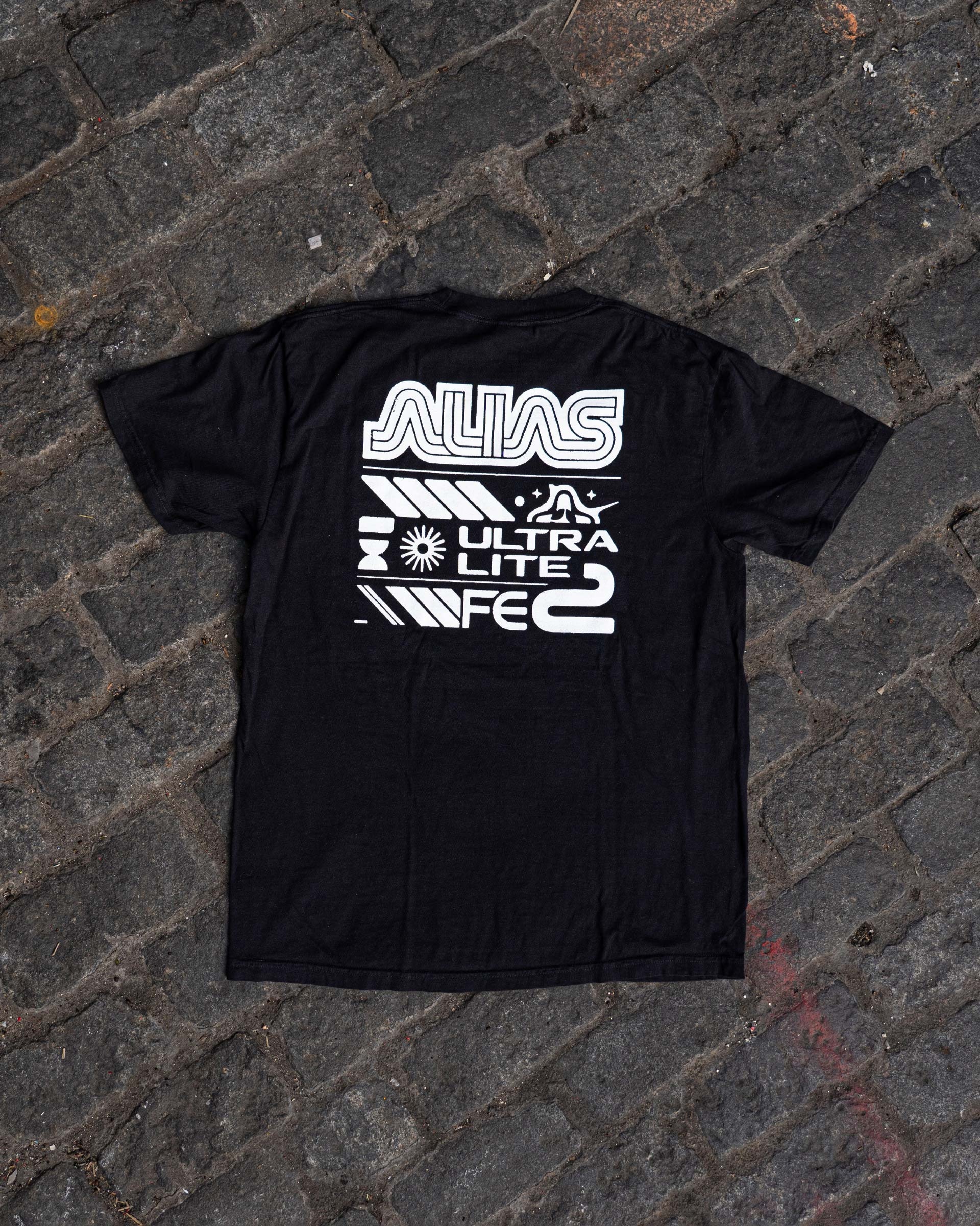 Black graphic tee on street