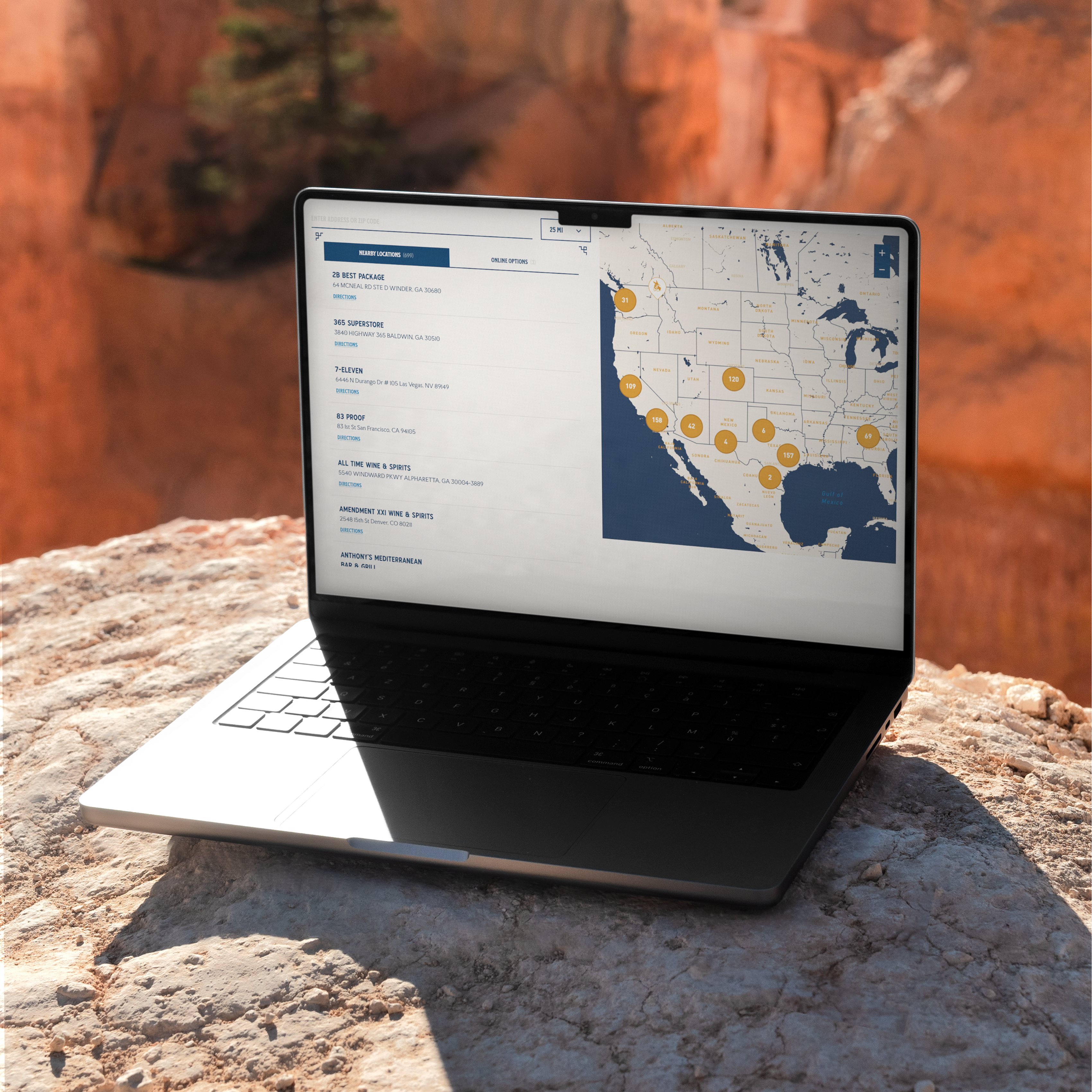 Laptop with Smokeye Hill website on large rock