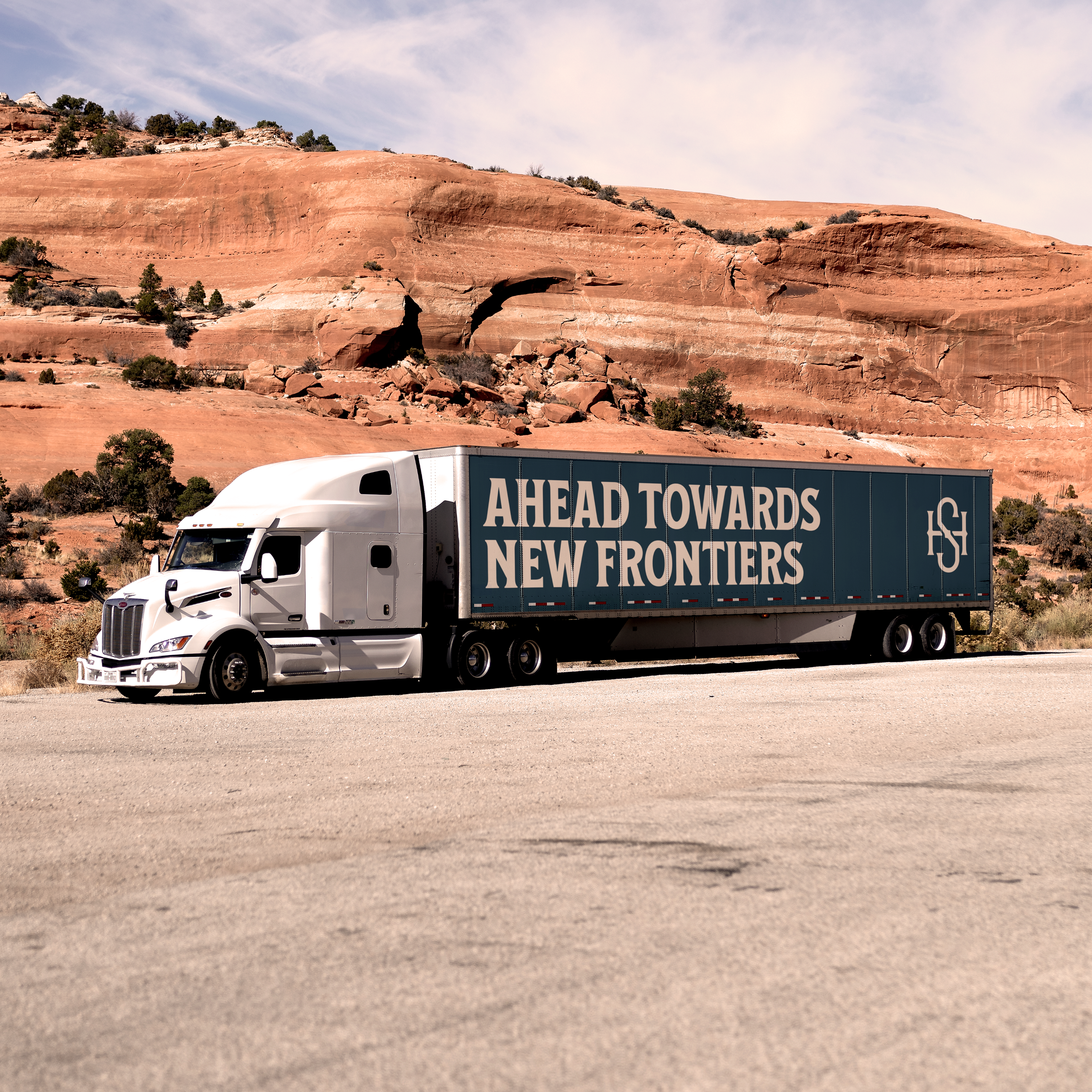 Truck that says "Ahead towards new frontiers"