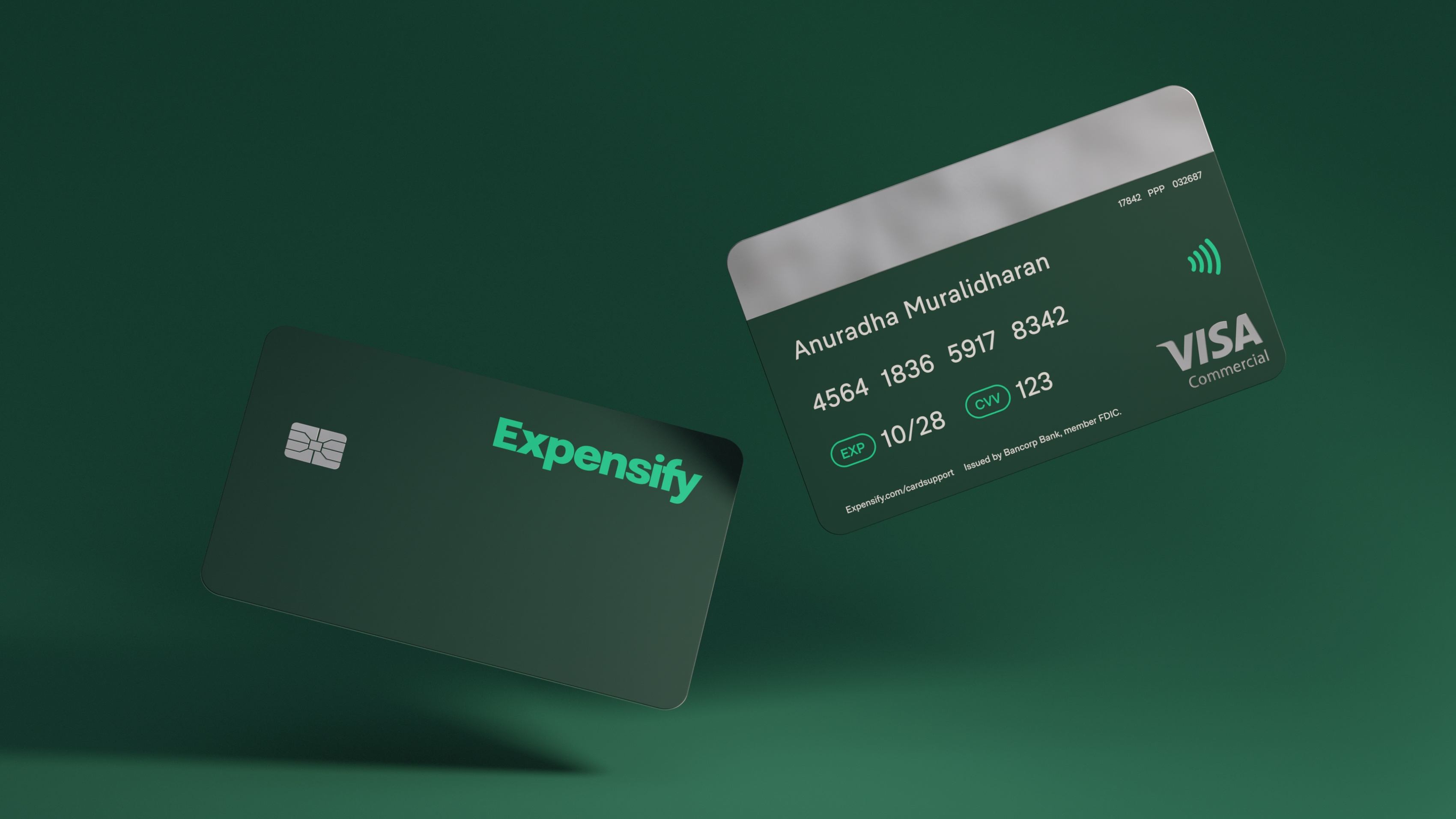 A green credit card with Expensify branding on it.