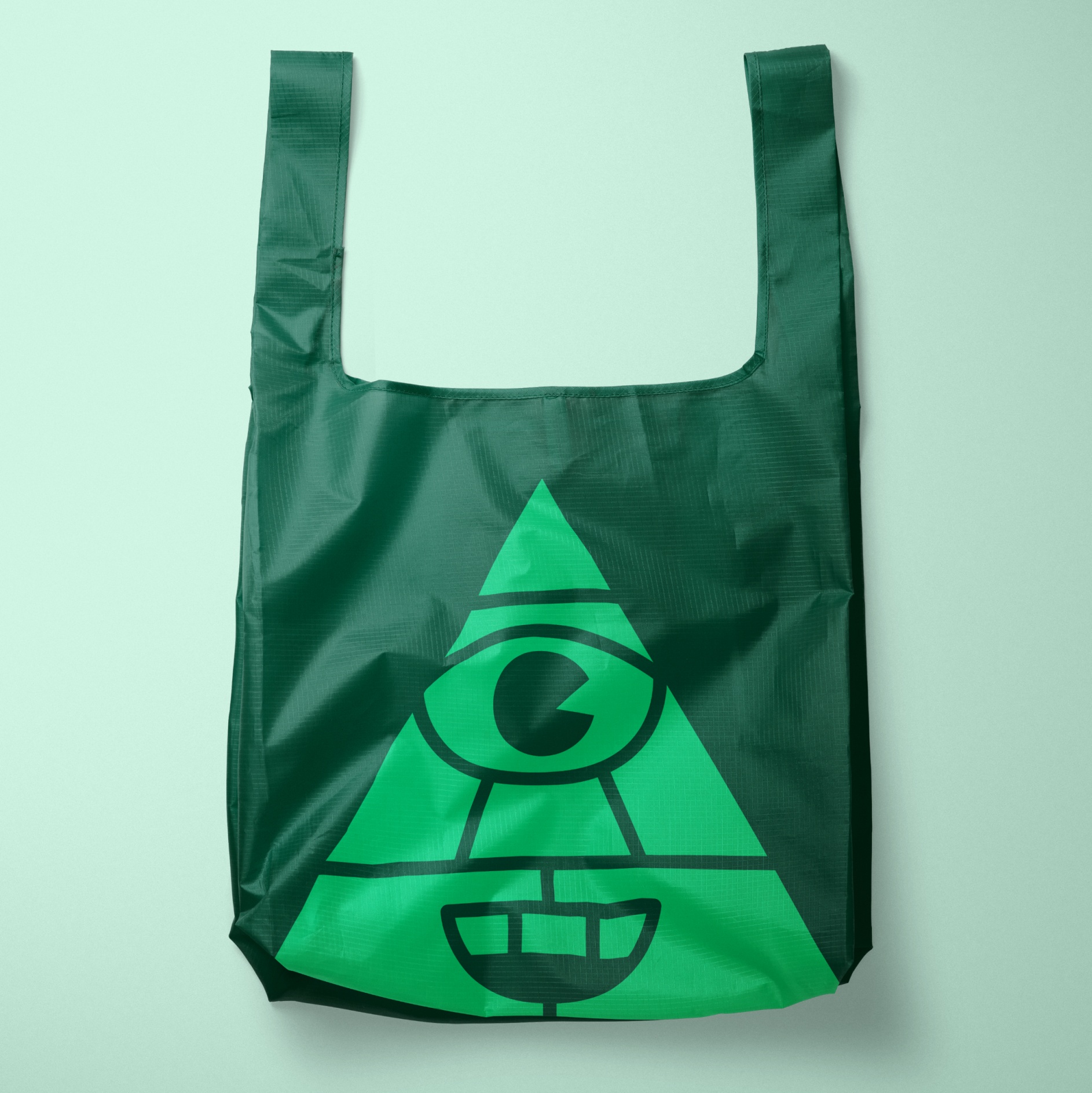 A custom Baggu bag showing one of the Expensify graphics, an all-seeing-eye.