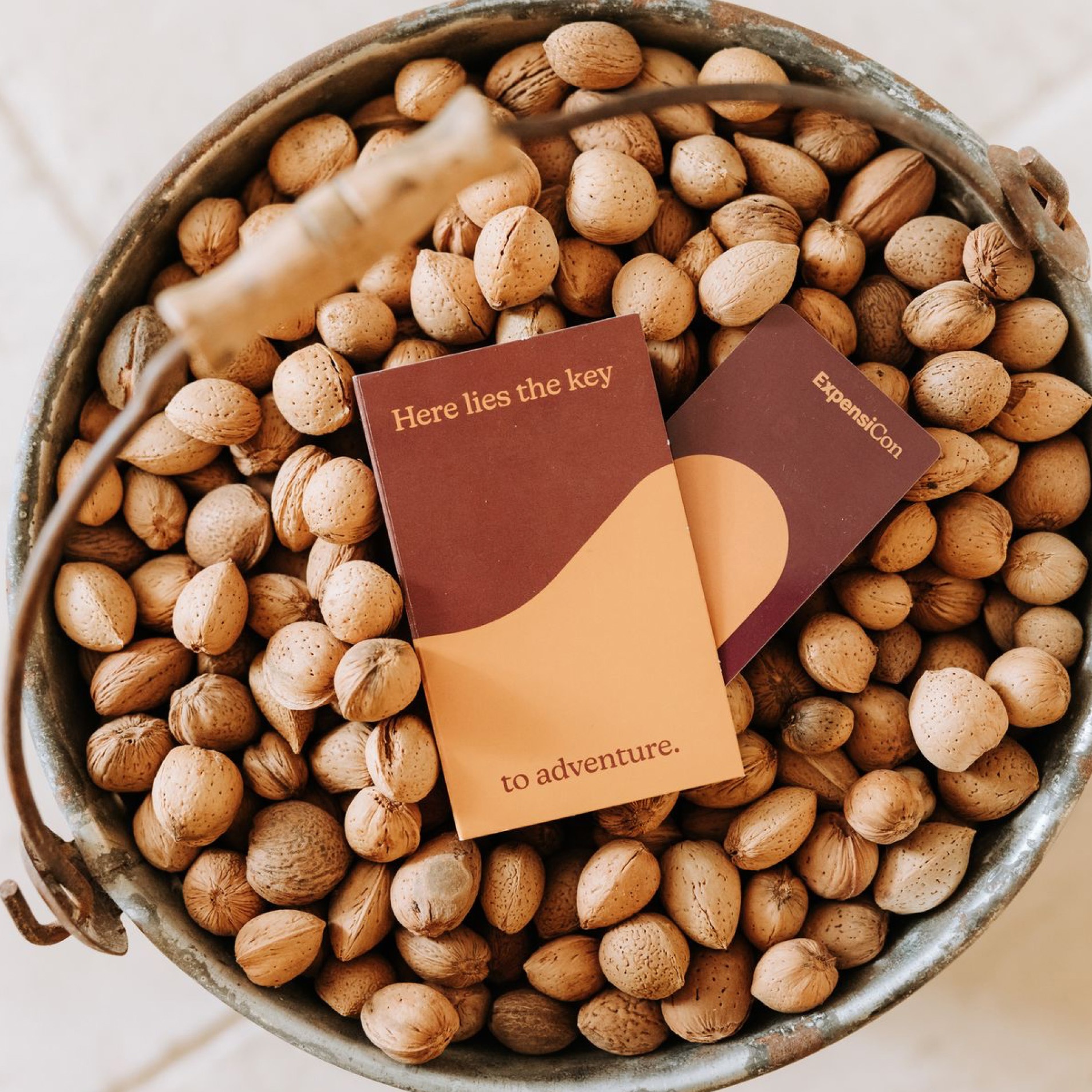 Photo of Expensicon keycard holders on top of a bucket of nuts