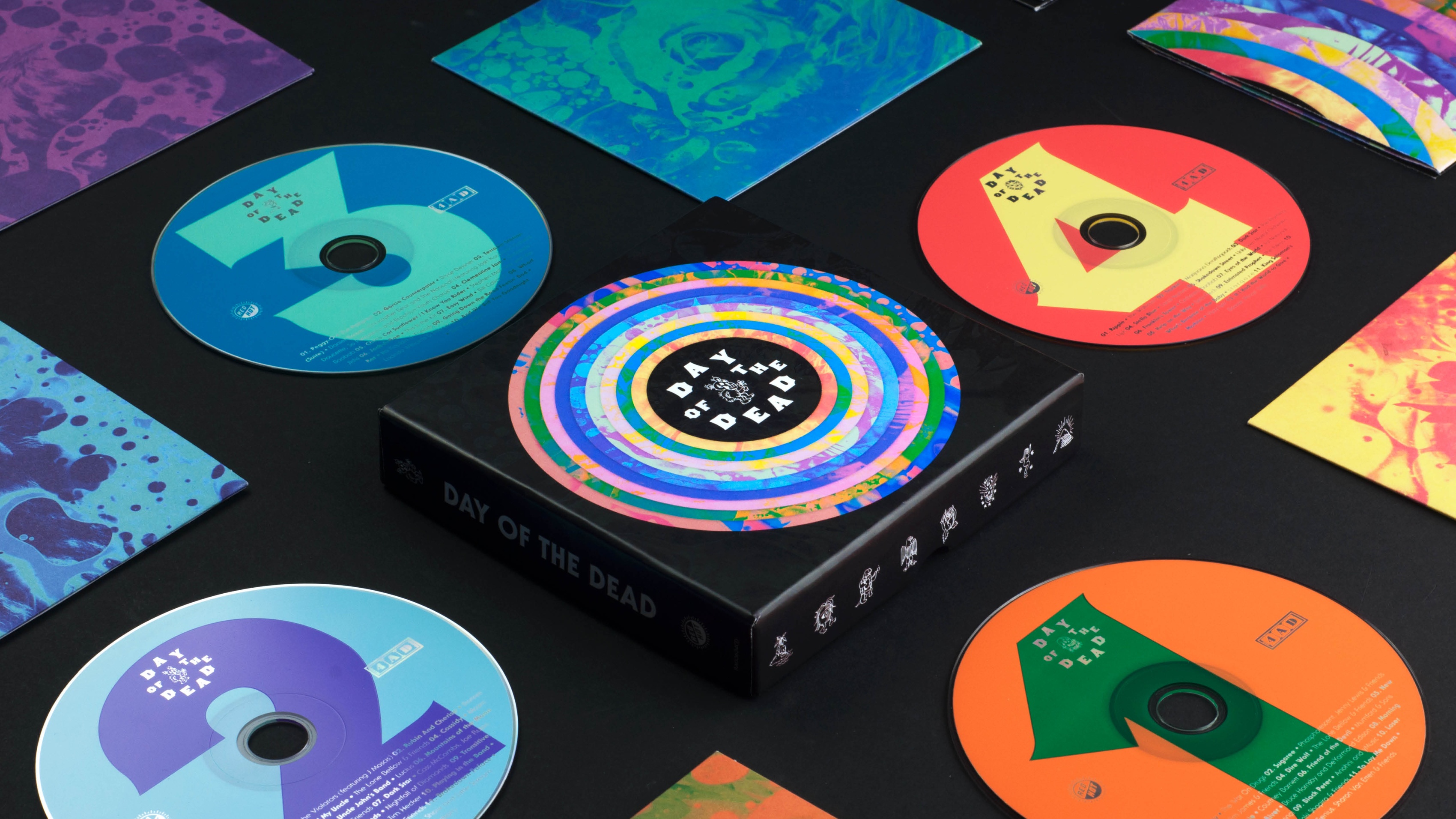 Rendering of the album packaging with the inserts and CDs arranged in a checkerboard pattern