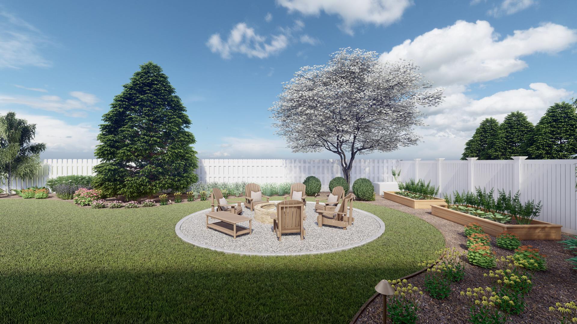 a small fire pit area with gravel in the corner of a backyard with a white privacy fence and large flowering tree