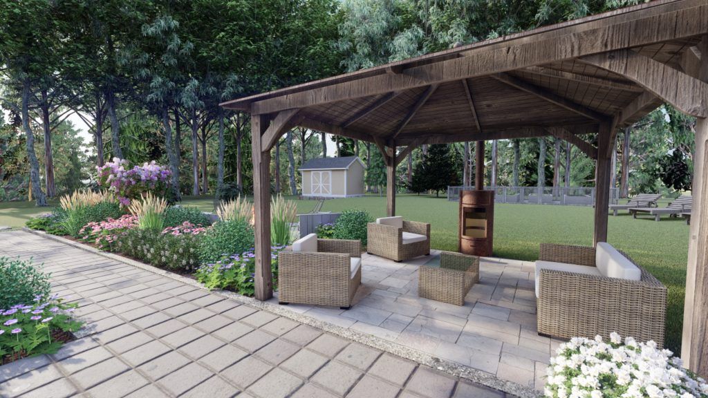 backyard design with a pergola, lawn and fire pit chiminea