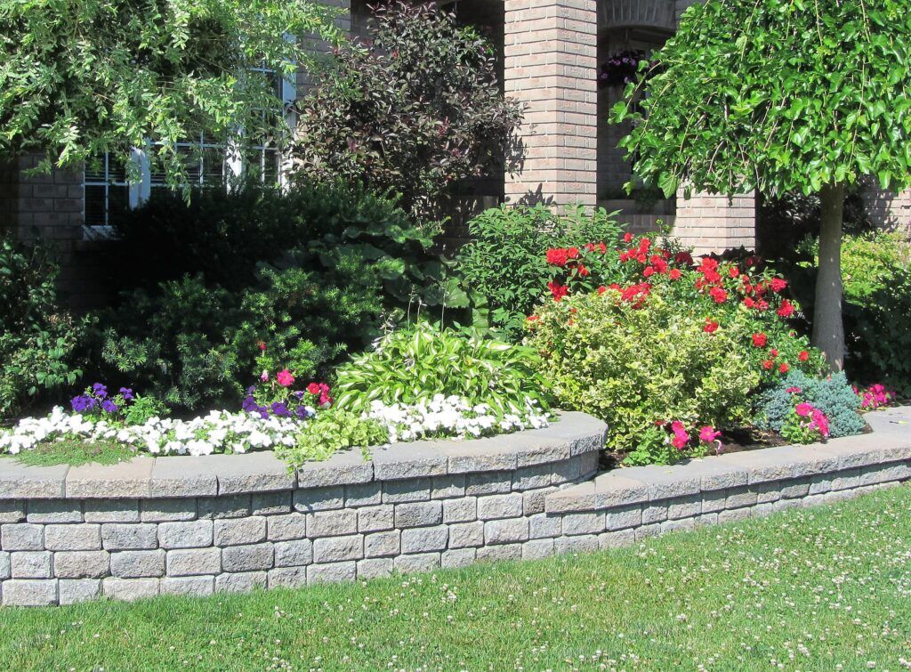 a round flower bed in a front yard