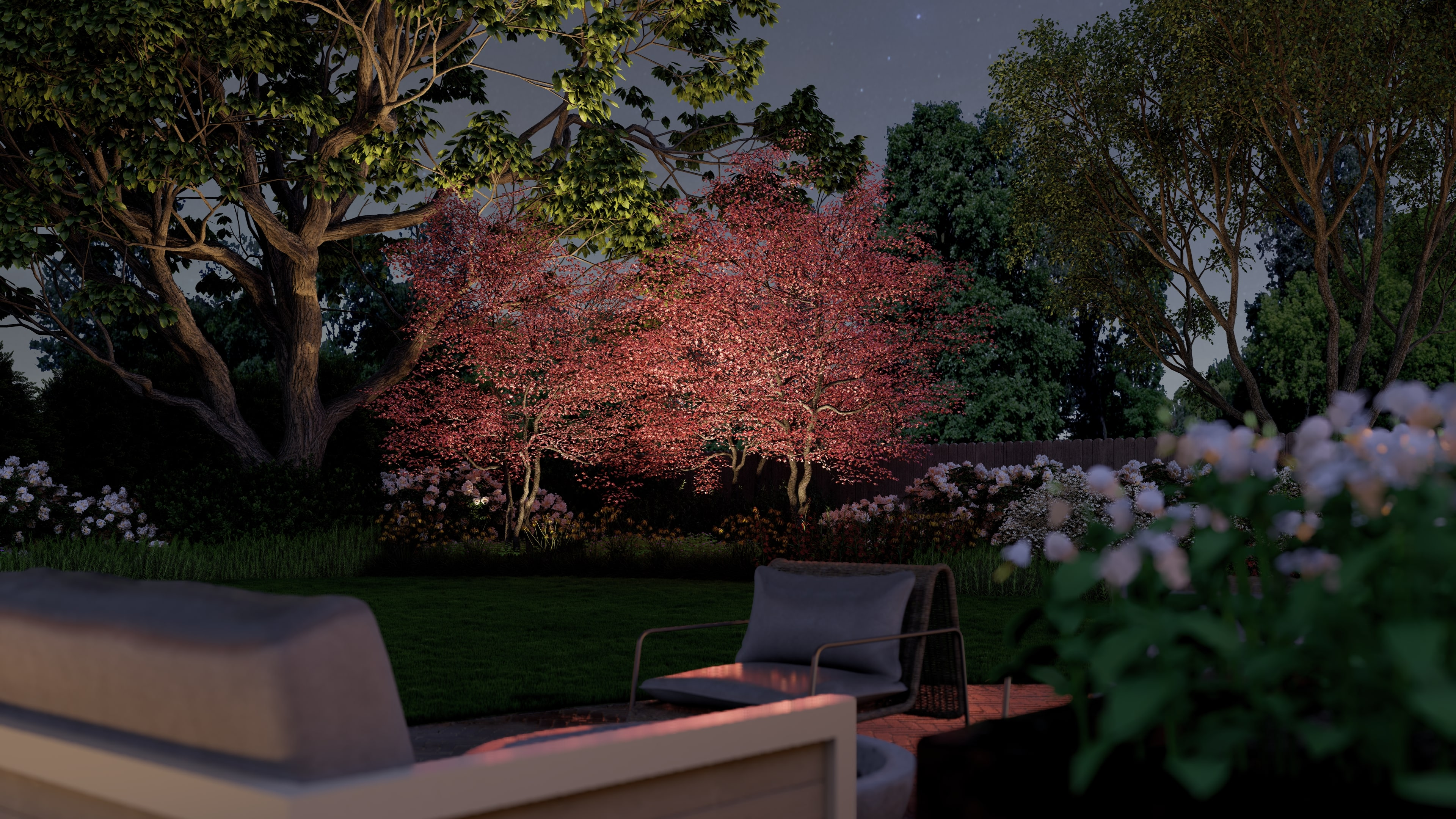 Landscape lighting that highlights a spring flowering tree